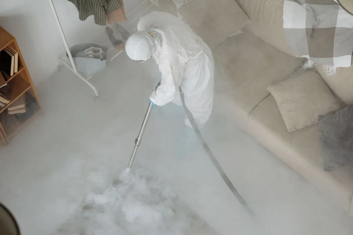 Biohazard cleanup technician in protective equipment, Port Townsend, WA